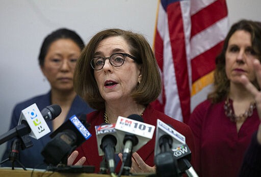 Oregon Governor Kate Brown speaks during a press conference with state and local government officials Thursday, March 12, 2020 in Portland to talk about coronavirus plans and protocols in the state. (Beth Nakamura/The Oregonian via AP)