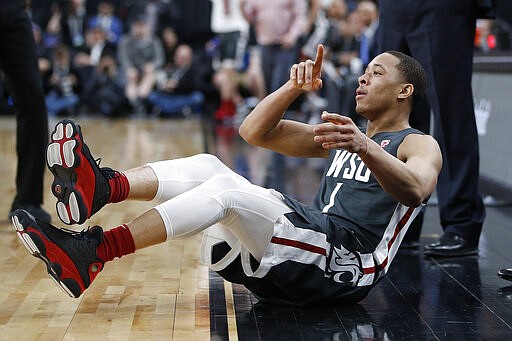 Washington State's Jervae Robinson (1) reacts after making a 3-point shot against Colorado during the first half of an NCAA college basketball game in the first round of the Pac-12 men's tournament Wednesday, March 11, 2020, in Las Vegas. (AP Photo/John Locher)