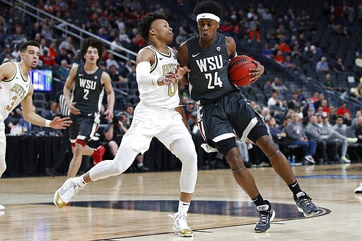 Washington State's Noah Williams (24) drives into Colorado's Shane Gatling (0) during the first half of an NCAA college basketball game in the first round of the Pac-12 men's tournament Wednesday, March 11, 2020, in Las Vegas. (AP Photo/John Locher)