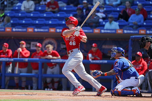 St. Louis Cardinals' Paul Goldschmidt (46) follows through on a solo home run during the first inning of a spring training baseball game against the New York Mets Friday, Feb. 28, 2020, in Port St. Lucie, Fla. (AP Photo/Jeff Roberson)