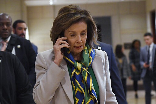 House Speaker Nancy Pelosi of Calif., walks on Capitol Hill in Washington, Thursday, March 12, 2020, as she heads to a briefing on the coronavirus. (AP Photo/Susan Walsh)