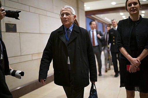 Dr. Anthony Fauci, director of the National Institute of Allergy and Infectious Diseases, arrives at the Capitol to update all members of Congress on the coronavirus outbreak, in Washington, Thursday, March 12, 2020. (AP Photo/J. Scott Applewhite)