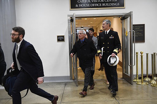 National Institute for Allergy and Infectious Diseases Director Dr. Anthony Fauci walks on Capitol Hill in Washington, Thursday, March 12, 2020, in between briefings on the coronavirus. (AP Photo/Susan Walsh)