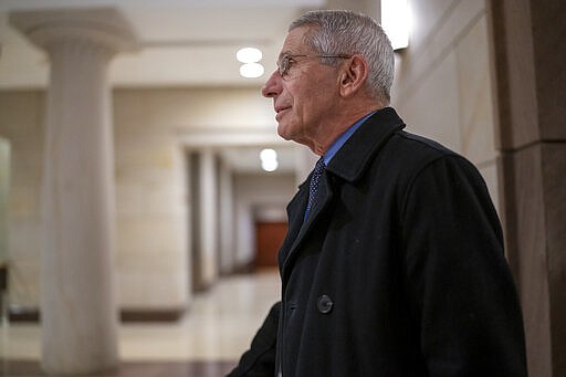 Dr. Anthony Fauci, director of the National Institute of Allergy and Infectious Diseases, arrives at the Capitol to update all members of Congress on the coronavirus outbreak, in Washington, Thursday, March 12, 2020. (AP Photo/J. Scott Applewhite)