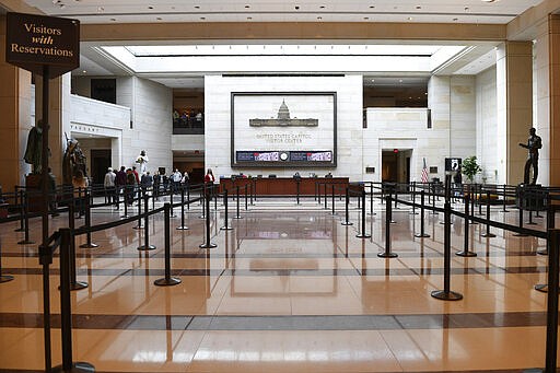 A smaller number of tourists visit the Capitol Visitors Center on Capitol Hill in Washington, Thursday, March 12, 2020. Congress is shutting the Capitol to the public until April in reaction to the spread of the coronavirus, officials announced Thursday, a rare step that underscores the growing gravity with which the government is reacting to the viral outbreak. (AP Photo/Susan Walsh)