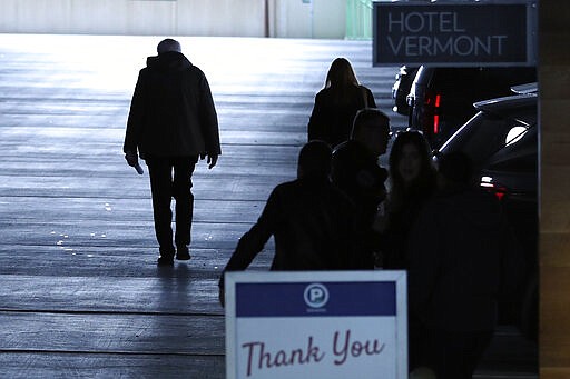 Democratic presidential candidate, Sen. Bernie Sanders, I-Vt., walks to his car after speaking to reporters on Wednesday, March 11, 2020, in Burlington, Vt. (AP Photo/Charles Krupa)