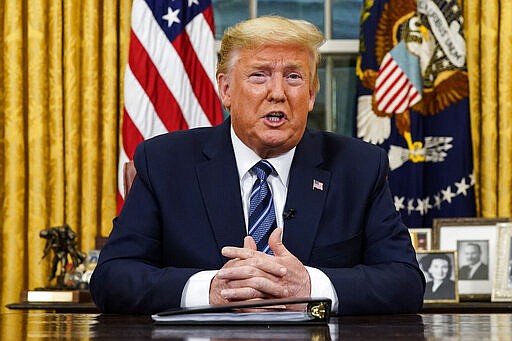 President Donald Trump speaks in an address to the nation from the Oval Office at the White House about the coronavirus Wednesday, March, 11, 2020, in Washington. (Doug Mills/The New York Times via AP, Pool)