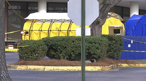 This Friday, March 13, 2020 photo shows tents set up outside the Lexington Medical Center hospital in West Columbia, S.C. U.S. hospitals are setting up tents for testing, canceling elective surgeries, calling on retired doctors for help and confronting the possibility they will have to ration treatment as they prepare for an expected onslaught of coronavirus patients. (AP Photo/Sarah Blake Morgan)