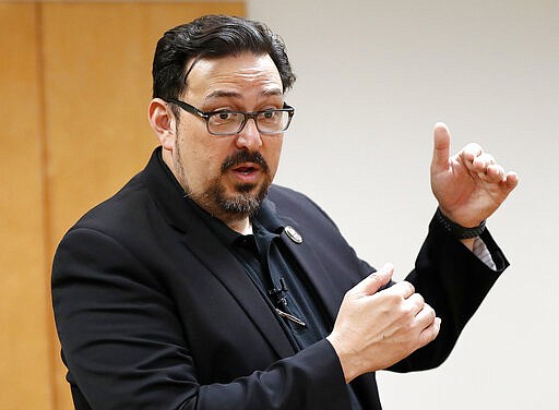 FILE - In this Nov. 6, 2018, file photo, Maricopa County Recorder Adrian Fontes speaks at the Tabulation and Election Center in Phoenix. The top election official in Arizona's most populous county took the unprecedented step Friday, March 13, 2020, of ordering ballots for next week's Democratic presidential primary mailed to all voters who normally casts ballots at the polls to ensure they can vote with minimal exposure to the new coronavirus. But the move by Maricopa County Recorder Adrian Fontes may not stand and drew some criticism from fellow Democrats, Maricopa County Supervisor Steve Garrado, and Secretary of State Katie Hobbs. (AP Photo/Matt York, File)