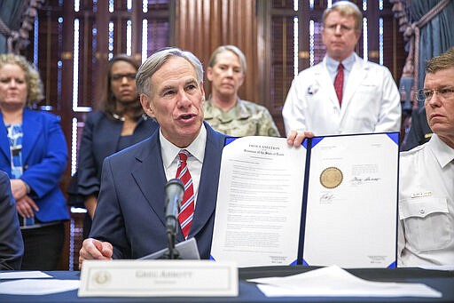 Governor Greg Abbott declares a statewide public health disaster because of COVID-19, the coronavirus, during a press conference at the Texas State Capitol in Austin, Texas on March 13, 2020. Abbott said there were 39 confirmed cases of the virus in Texas with 220 total people tested. The vast majority of people recover from the new coronavirus. According to the World  Health Organization, most people recover in about two to six weeks, depending on the severity of the illness. (Julia Robinson/The Dallas Morning News via AP)