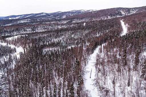 Tom Frode Johansen mushes on a road between Takotna and Ophir, Alaka, Thursday, March 12, 2020, during the Iditarod Trail Sled Dog Race. (Loren Holmes/Anchorage Daily News via AP)