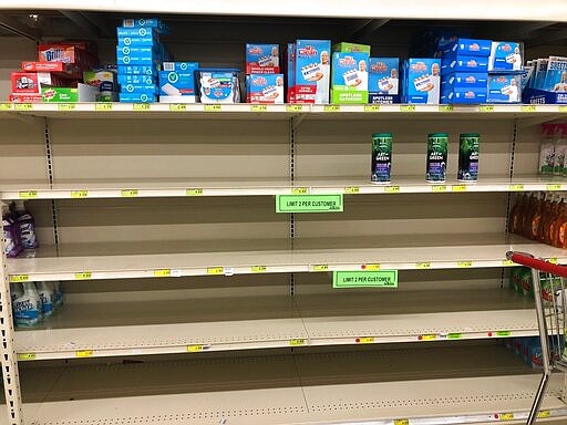 Shelves are largely empty at Woodman's Markets in Kenosha, Wis., Thursday, March 12, 2020. Hand sanitizers, hand soaps and antibacterial wipes are in short supply as shoppers stock up amid the new coronavirus. (AP Photo/Nam Y. Huh)