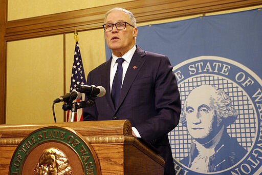 Washington Gov. Jay Inslee speaks to the media after the Legislature adjourned its 60-day session, Thursday, March 12, 2020, in Olympia, Wash. State lawmakers passed a supplemental budget with funding for the state's response to COVID-19. (AP Photo/Rachel La Corte)