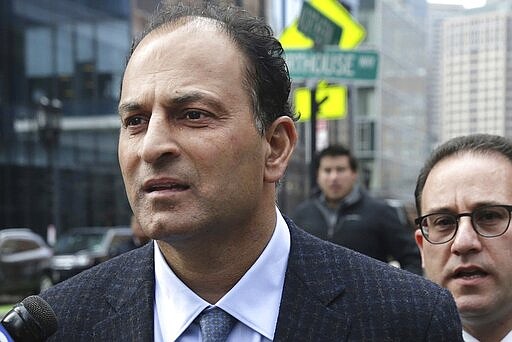 FILE - March 15, 2019, David Sidoo, of Vancouver, Canada, leaves following his federal court hearing in a nationwide college admissions cheating scheme in Boston. Sidoo pleaded guilty to a mail fraud conspiracy charge in Boston federal court on Friday, March 13, 2020. (Jonathan Wiggs/The Boston Globe via AP, File)