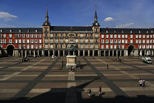 A general view of Mayor square in central Madrid, Spain, Friday, March 13, 2020. Exhibitions, conferences, sports centers and museums are closing in Madrid, including the Spanish capital's Prado Museum for the first time in eight decades. For some, especially older adults and people with existing health problems, it can cause more severe illness, including pneumonia. (AP Photo/Manu Fernandez)