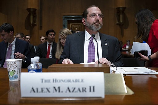 FILE - In this Feb. 13, 2020 file photo, Secretary of Health and Human Services Alex Azar testifies on Capitol Hill in Washington.  Democrats controlling the House wrote HHS Secretary Alex Azar earlier this month to request funds to help speed development of a coronavirus vaccine, expand laboratory capacity, and beef up screening efforts at U.S. entry points. Azar is slated to testify before the Senate Appropriations Committee on Tuesday, and the U.S. response to the outbreak is sure to be a major topic. (AP Photo/J. Scott Applewhite)