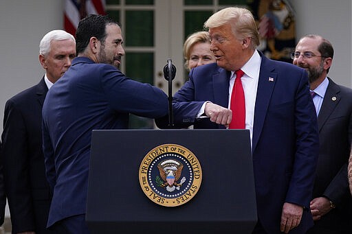 LHC Group&#146;s Bruce Greenstein elbow bumps with President Donald Trump during a news conference about the coronavirus in the Rose Garden at the White House, Friday, March 13, 2020, in Washington. (AP Photo/Evan Vucci)