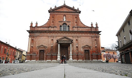 In this photo taken on Thursday, March 12, 2020, a view of the almost empty main square in Codogno, Italy. The northern Italian town that recorded Italy&#146;s first coronavirus infection has offered a virtuous example to fellow Italians, now facing an unprecedented nationwide lockdown, that by staying home, trends can reverse. Infections of the new virus have not stopped in Codogno, which still has registered the most of any of the 10 Lombardy towns Italy&#146;s original red zone, but they have slowed. For most people, the new coronavirus causes only mild or moderate symptoms. For some it can cause more severe illness. (AP Photo/Antonio Calanni)