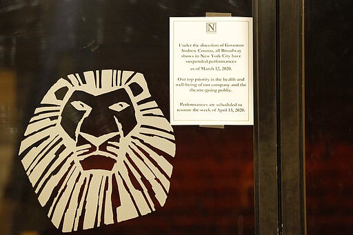 A sign announcing the suspension of all Broadway shows is posted on a door at the Minskoff Theatre, where &quot;The Lion King&quot; had been playing, Thursday, March 12, 2020, in New York. Gov. Andrew Cuomo banned gatherings of more than 500 people. (AP Photo/Kathy Willens)