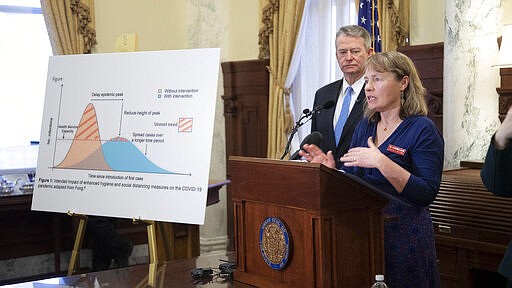 State epidemiologist Dr. Christine Hahn answers questions about Idaho's response to the coronavirus pandemic during a press conference Friday, March 13, 2020 in Boise, Idaho, called by Gov. Brad Little to announce a proactive state of emergency in Idaho. (Darin Oswald/Idaho Statesman via AP)