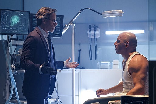 This image released by Columbia Pictures shows Guy Pearce, left, and Vin Diesel in a scene from &quot;Bloodshot.&quot; (Graham Bartholomew/Sony/Columbia Pictures via AP)