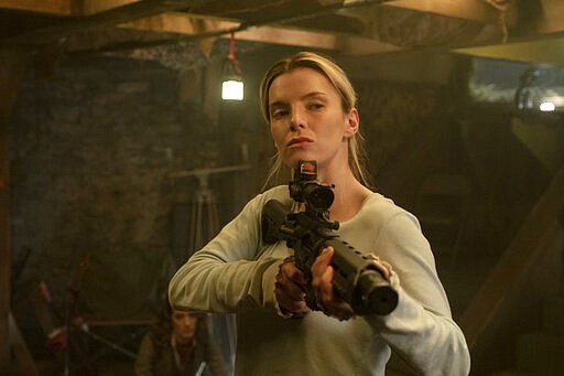 This image released by Universal Pictures shows Betty Gilpin in a scene from &quot;The Hunt.&quot; (Patti Perret/Universal Pictures via AP)