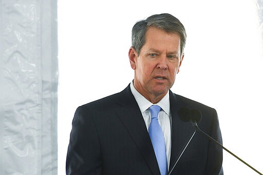 In this Feb. 11, 2020, photo, Georgia Governor Brian Kemp speaks during a dedication of the state's new Nathan Deal Judicial Center in Atlanta. Georgia election officials are postponing the state&#146;s March 24 presidential primaries until May because of fears over the coronavirus. (AP Photo/John Amis)