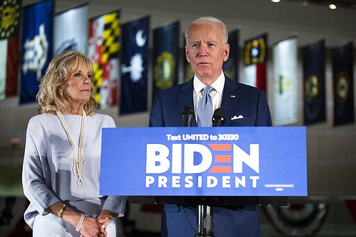 Democratic presidential candidate former Vice President Joe Biden, accompanied by his wife Jill, speaks to members of the press at the National Constitution Center in Philadelphia, Tuesday, March 10, 2020. (AP Photo/Matt Rourke)