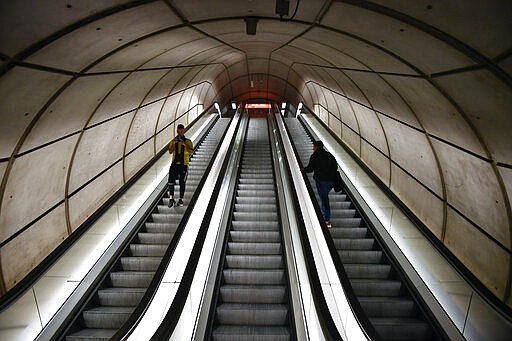 Passengers use the escalators of an empty subway station, in Bilbao, northern Spain, Saturday, March 14, 2020. Spain's prime minister has announced a two-week state of emergency from Saturday in a bid to contain the new coronavirus outbreak. For most people, the new COVID-19 coronavirus causes only mild or moderate symptoms, such as fever and cough, but for some, especially older adults and people with existing health problems, it can cause more severe illness, including pneumonia. (AP Photo/Alvaro Barrientos)