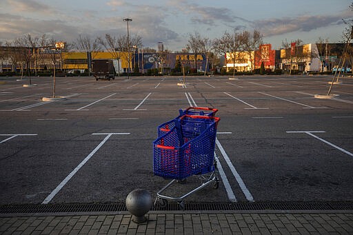 Shopping carts in the middle of an empty parking lot in a shopping area in San Sebastian de los Reyes, outskirts Madrid, Spain, Saturday, March 14, 2020. Spain's government announced Saturday that it is placing tight restrictions on movements and closing restaurants and other establishments in the nation of 46 million people as part of a two-week state of emergency to fight the sharp rise in coronavirus infections. Spain has followed Italy's path in implementing a similar lockdown after both European countries failed to contain the virus in regional hotspots. The vast majority of people recover from the new coronavirus. According to the World Health Organization, most people recover in about two to six weeks, depending on the severity of the illness. (AP Photo/Bernat Armangue)