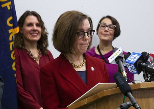 Oregon Governor Kate Brown speaks during a press conference with state and local government officials Thursday, March 12, 2020 in Portland to talk about coronavirus plans and protocols in the state. (Beth Nakamura/The Oregonian via AP)