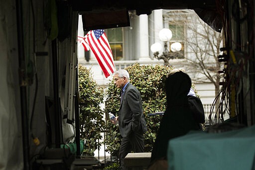 Director of the National Institute of Allergy and Infectious Diseases at the National Institutes of Health Anthony Fauci walks on the North Lawn outside the West Wing at the White House, after TV interviews Thursday, March 12, 2020, in Washington. (AP Photo/Manuel Balce Ceneta)