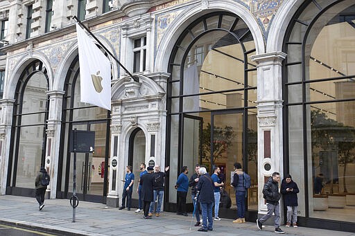 Members of staff stand outside of the Apple Store informing people of their closure, on Regent Street, London, Saturday, March 14, 2020. Tech giant Apple is closing its stores outside of China for two weeks and will only sell online as part of efforts to fight the global viral pandemic. &#147;In our workplaces and communities, we must do all we can to prevent the spread of COVID-19,&#148; CEO Tim Cook tweeted Saturday. &#147;Apple will be temporarily closing all stores outside of Greater China until March 27 and committing $15M to help with worldwide recovery.&quot; For most people, the new coronavirus causes only mild or moderate symptoms. For some, it can cause more severe illness, especially in older adults and people with existing health problems. (Rick Findler/PA via AP)