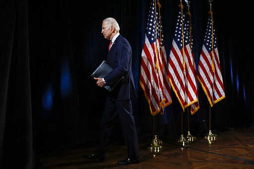 Democratic presidential candidate former Vice President Joe Biden departs after speaking about the coronavirus Thursday, March 12, 2020, in Wilmington, Del. (AP Photo/Matt Rourke)