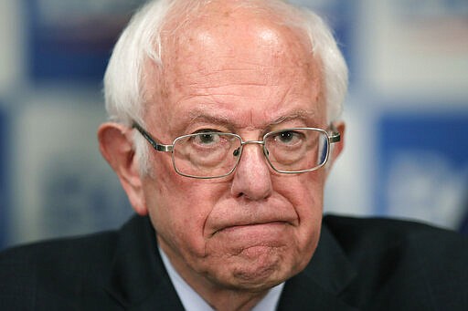 Democratic presidential candidate, Sen. Bernie Sanders, I-Vt., speaks to reporters about coronavirus Thursday March 12, 2020, in Burlington, Vt. (AP Photo/Charles Krupa)