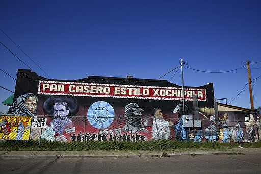 This March 3, 2020 photo shows a mural on the side of a Mexican bakery in downtown Phoenix, Ariz. (AP Photo/Dario Lopez-MIlls)