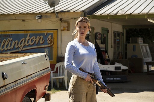 This image released by Universal Pictures shows Betty Gilpin in a scene from &quot;The Hunt.&quot; (Patti Perret/Universal Pictures via AP)