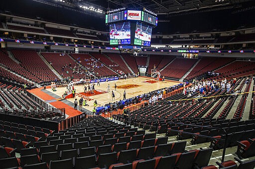 Omaha Skutt takes on Norris during the first day of the Nebraska boys state high school basketball tournament at Pinnacle Bank Arena Thursday, March 12, 2020, in Lincoln, Neb. The fans were restricted to staff and immediate family members due to concerns over the coronavirus.  (Chris Machian/Omaha World-Herald via AP)