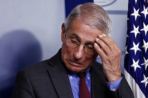 Dr. Anthony Fauci, director of the National Institute of Allergy and Infectious Diseases, listens during a briefing on coronavirus in the Brady press briefing room at the White House, Saturday, March 14, 2020, in Washington. (AP Photo/Alex Brandon)