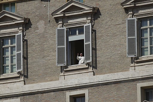 Pope Francis delivers his blessing from his studio window overlooking St. Peter's Square at the Vatican, Sunday March 15, 2020. For most people, the new coronavirus causes only mild or moderate symptoms. For some, it can cause more severe illness, especially in older adults and people with existing health problems. (AP Photo/Alessandra Tarantino)