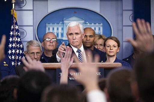 Vice President Mike Pence points to a question as he speaks during a briefing about the coronavirus in the James Brady Press Briefing Room of the White House, Sunday, March 15, 2020, in Washington. (AP Photo/Alex Brandon)