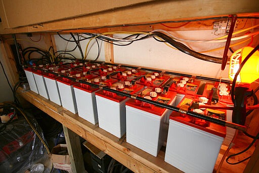 In this undated photo provided by Paul Buescher, a solar power 12-volt battery bank is stored in a barn near Garrettsville, Ohio. The battery bank can be used by 32 members of a group in northeastern Ohio that shares a farm packed with enough canned and dehydrated food and water to last for years. For those in the often-mocked &quot;prepper&quot; community, this is quickly becoming their &quot;I told you so&quot; moment, as panic buying has cleared store shelves across the U.S. amid growing fears that the new coronavirus will force many Americans to self-quarantine for weeks in their homes. (Paul Buescher via AP)