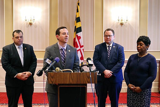 Maryland Senate President Bill Ferguson announces that the state's 90-day legislative session will end early in response to coronavirus, Sunday, March 15, 2020 in Annapolis, Md. Ferguson said the session will end Wednesday, instead of the scheduled end on April 6. He made the announcement with Sen. J.B. Jennings, left, Del. Nic Kipke, second from right, and House Speaker Adrienne Jones, right. (AP Photo/Brian Witte)