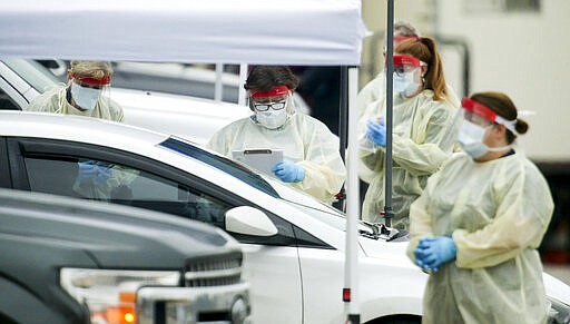 DCH Regional Medical Center opened a drive through testing facility for the Covid-19, the disease that is caused by the new coronavirus, Monday, March 16, 2020, in Tuscaloosa, Alabama. Tuscaloosa had three confirmed cases of Covid-19 as of Monday morning. (Gary Cosby Jr./The Tuscaloosa News via AP)