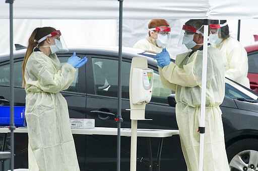 DCH Regional Medical Center opened a drive through testing facility for the Covid-19, the disease that is caused by the new coronavirus, Monday, March 16, 2020, in Tuscaloosa, Alabama. Tuscaloosa had three confirmed cases of Covid-19 as of Monday morning. (Gary Cosby Jr./The Tuscaloosa News via AP)