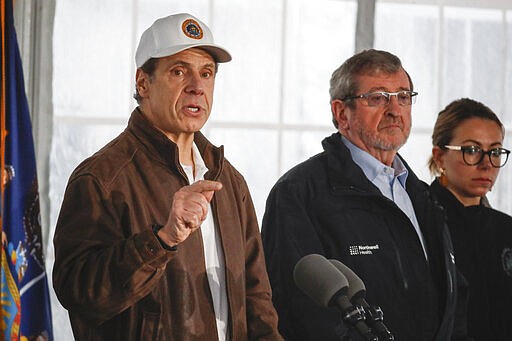 FILE - In this Friday, March 13, 2020, file photo, New York Governor Andrew Cuomo speaks during a news conference at a COVID-19 coronavirus infection testing facility at Glen Island Park in New Rochelle, N.Y. Unlike other countries dealing with the coronavirus outbreak, the U.S. has left much of the response to its individual states. The response has been chaotic and led to concerns that the country has missed its golden hour to contain the virus. Now some of them, led by Cuomo, are calling for the federal government to take a more forceful and coordinated response before it's too late. (AP Photo/John Minchillo, File)