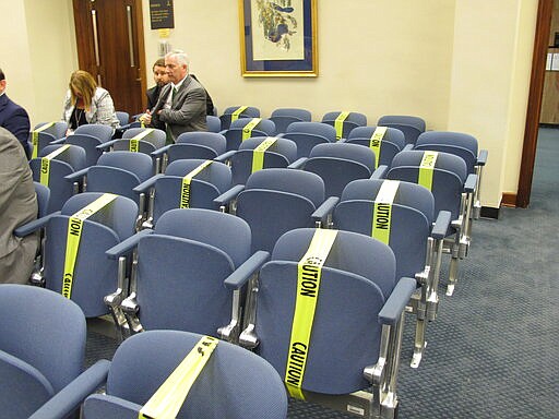 The Louisiana Capitol is limiting access to the public because of the coronavirus epidemic, taking temperatures to ensure people entering the building don't have a fever and requiring people to sit apart from each other in committee hearings, on Monday, March 16, 2020, in Baton Rouge, La. (AP Photo/Melinda Deslatte)