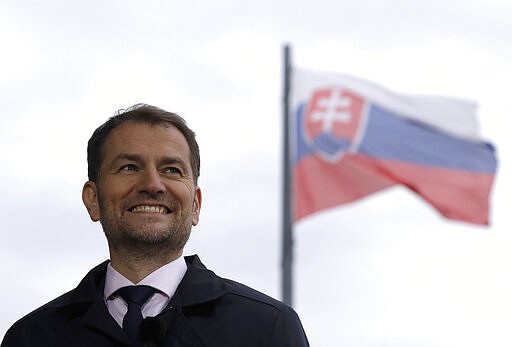 In this File picture taken on Sunday, March 1, 2020, leader of the Ordinary People and Independent Personalities party Igor Matovic arrives for an interview day after the Slovakia's general election in Bratislava. Slovakia is set to have a new government after the country's president agreed to swear in a coalition led by the winning party in the parliamentary election. President Zuzana Caputova said she would appoint on Saturday a four-party coalition lead by Igor Matovic whose center-right populist opposition group Ordinary People captured 25 percent of the Feb. 29 vote. (AP Photo/Petr David Josek/FILE)