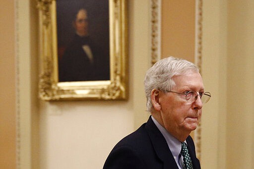 Senate Majority Leader Mitch McConnell of Ky. departs the Senate Chamber on Capitol Hill in Washington, Monday, March 16, 2020. With an urgency unseen since the Great Recession, Congress is rushing to develop a sweeping economic lifeline for American households and businesses suddenly capsized by the coronavirus outbreak. (AP Photo/Patrick Semansky)