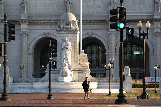 Washington Union Station, a major transportation hub in the nation's capital, is nearly empty during morning rush hour as many government and private sector workers stay home during the coronavirus outbreak, in Washington, Monday, March 16, 2020. (AP Photo/J. Scott Applewhite)